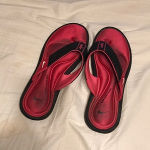 Nike pink foam flip flops